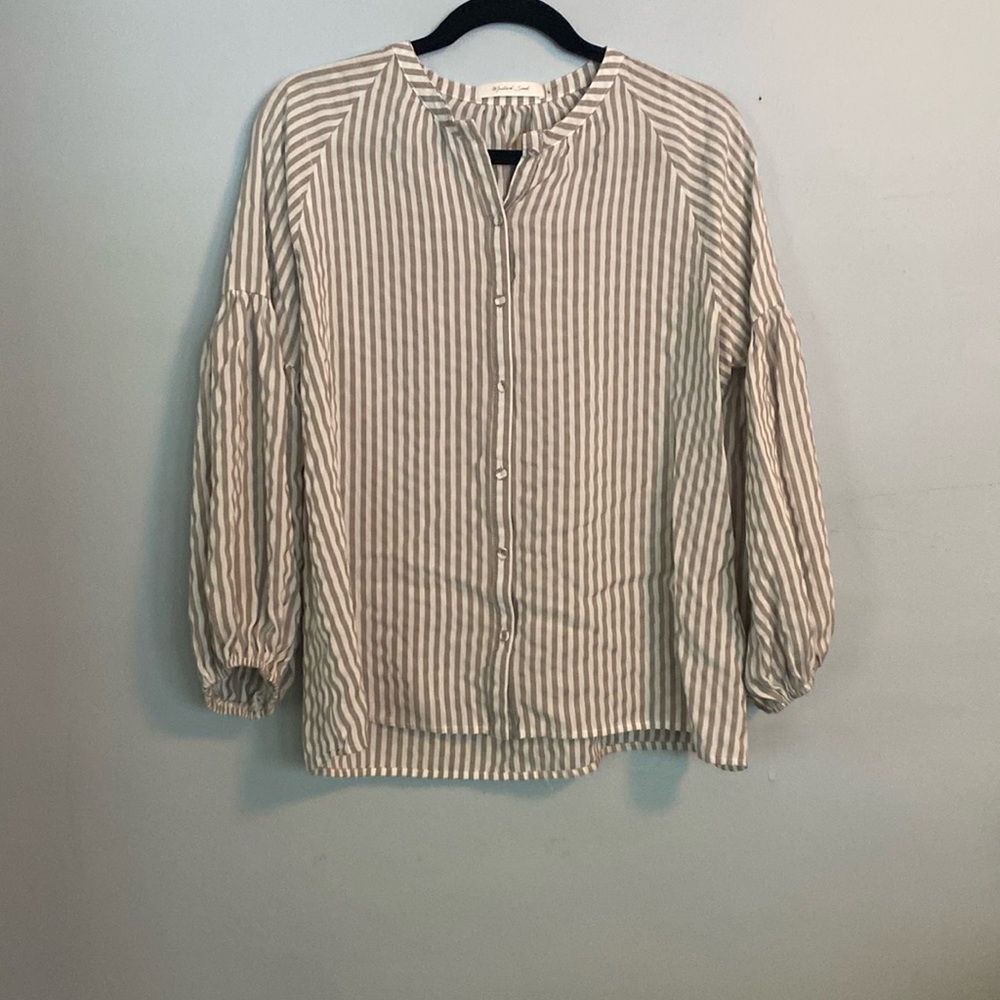 Mustard seed, grey and white top.